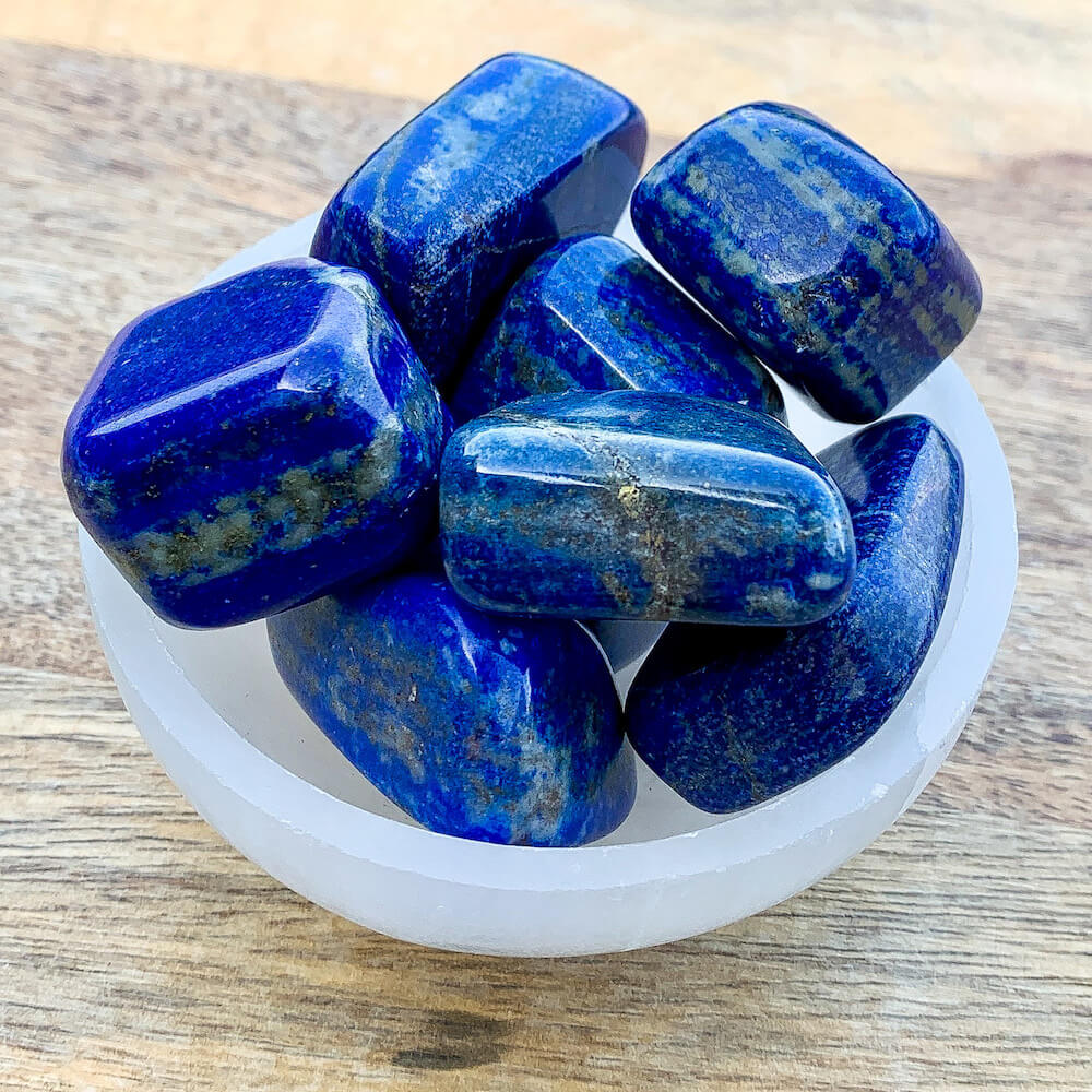 Buy Lapis Lazuli Tumbled Stones, Lapis Lazuli Polished Gemstones, Bulk Crystals, Polished Blue Stone at Magic Crystals. Lapis Lazuli can help with focus, wise, thinking, and memory. Intellectually stimulating. FREE SHIPPING available. Polished Lapis Lazuli best queality.