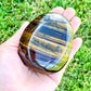Looking for Large Yellow Tiger Eye Tumbled Stone? Shop at Magic Crystals for Tiger Eye TUMBLED from Africa. Tumbled Tiger Eye also known as a Third Eye, Sacral Chakra gemstone is wonderful for balance, energy healing, and reiki. Tigers Eye Jewelry, Stones, bracelets, necklaces, and more with FREE SHIPPING available.
