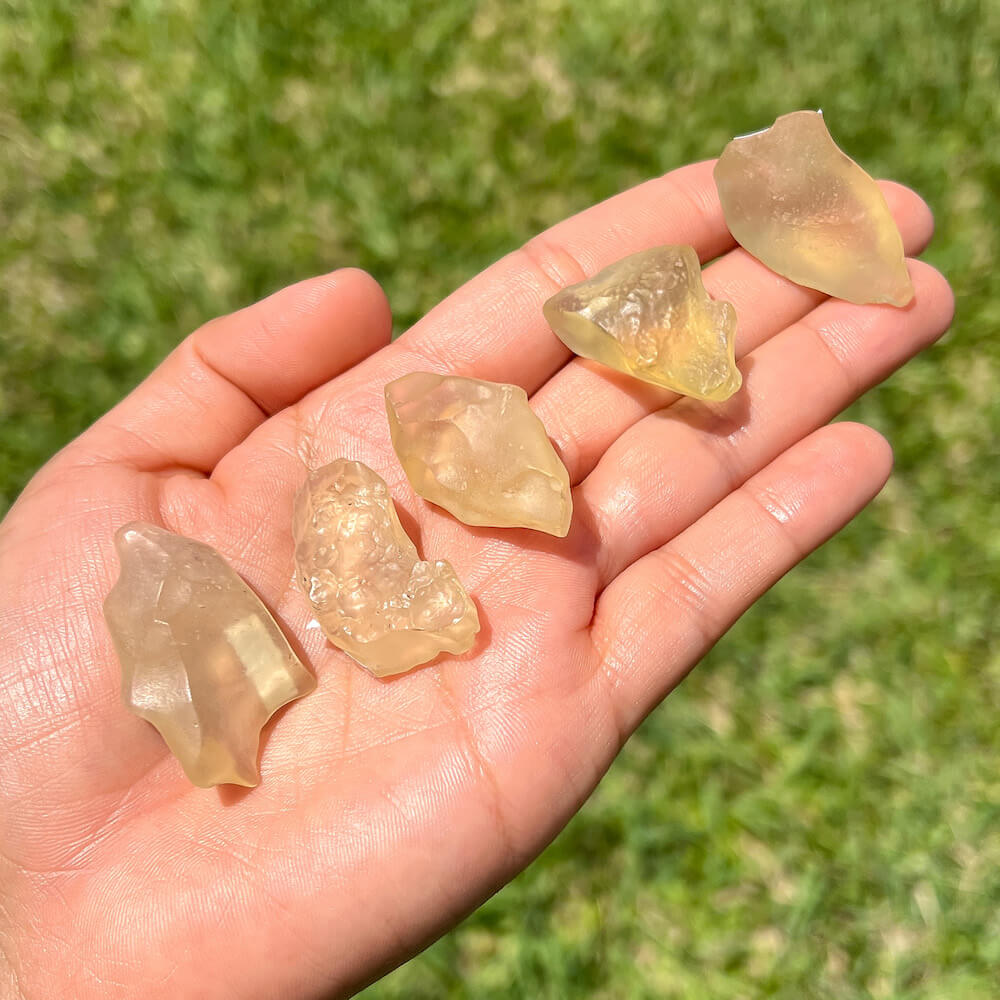 Looking for authentic real Libyan Desert Glass? Shop at Magic Crystals for Lybian Tektite 6-10 grams unique pieces by the gram. Yellow and gold tektite from Libya and Egypt. FREE SHIPPING available. Libyan Desert Glass will range between 5-30 mm depending on weight. Rare Tektite at MagicCrystals.com