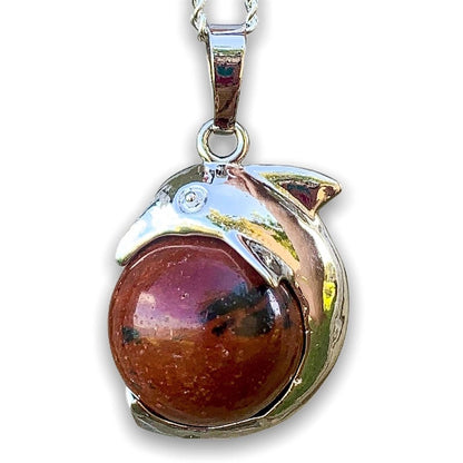 Mahogany-obsidian-Sphere-Dolphin-Pendant-Necklace   Mahogany-Obsidian-Sphere-Dolphin-Pendant-Necklace. Dolphin Necklace - Elegant Ocean-Themed Jewelry for Women Dolphin Charm Necklace at Magic Crystals. Boho Style Jewelry with Natural Gemstones. Stone Carved Dolphin Necklace Pendant, Beach Surf Ocean Boho Gemstone Whale Fairtrade Gift. These beautiful stone necklaces are all hand carved.