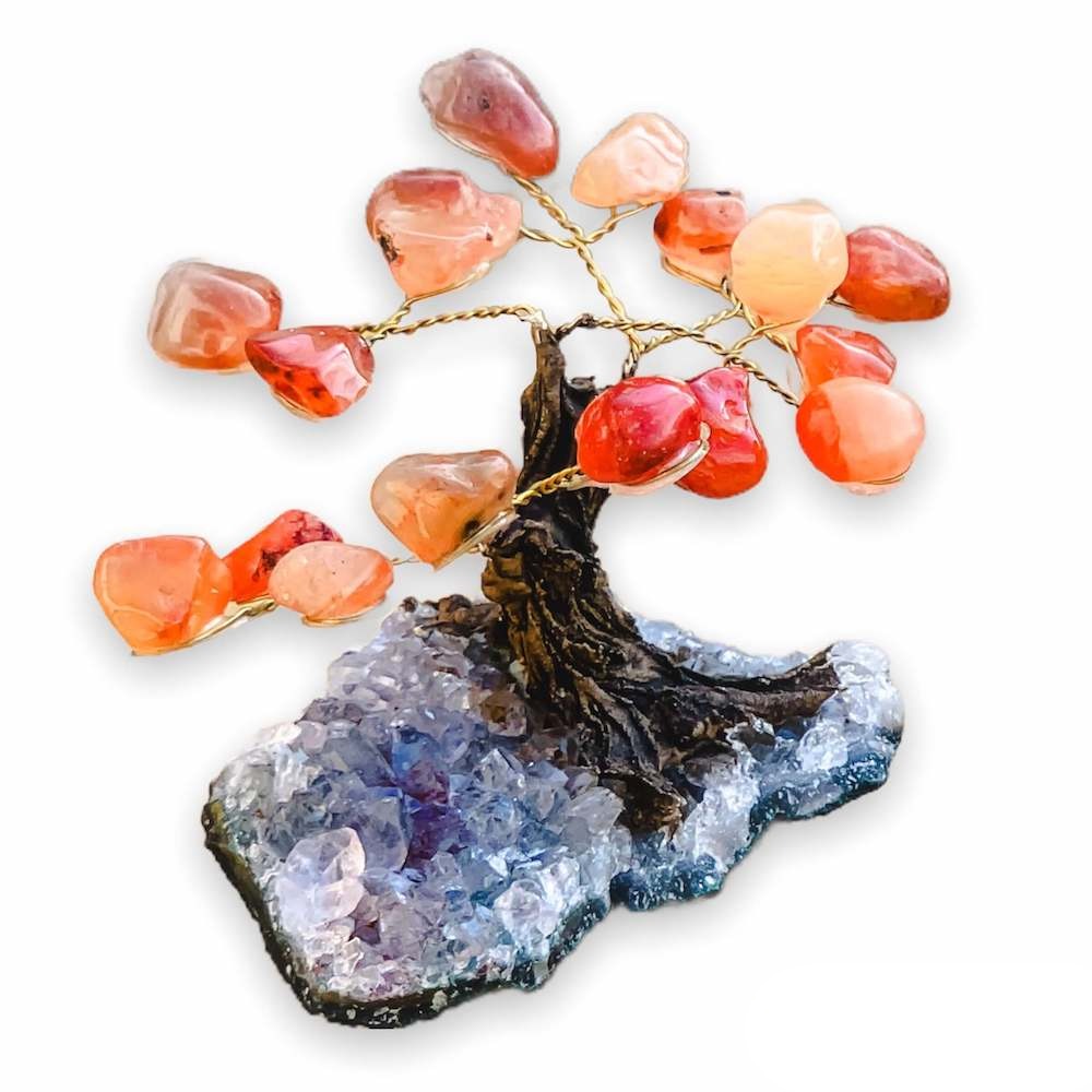 Buy Raw Mini Orange Carnelian Bonsai Tree on Amethyst Cluster in Magic Crystals. Carnelian is best for Motivation, Strength, and Leadership. Magic Crystals has a variety of HOME DECOR made of crystals and gemstones. Gemstone tree. Birthstone tree sculpture. Amethyst geode gift. FREE SHIPPING AVAILABLE.