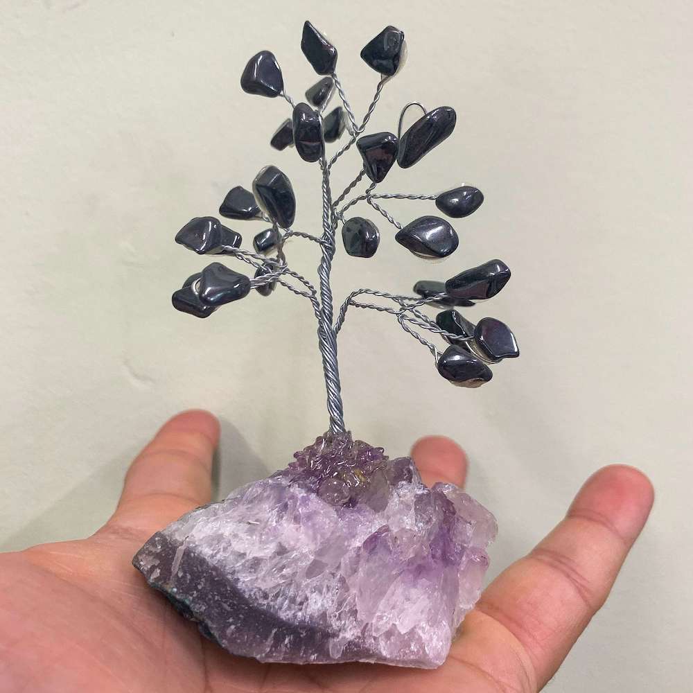 Looking for crystal home decor? Shop at Magiccrystals.com for Mini Gray Hematite Bonsai Tree on Amethyst Cluster. Magic Crystals has a variety of HOME DECOR made of crystals and gemstones. Hematite is known as the stone of grounding. Gemstone tree. Birthstone silver plated wire tree sculpture. Amethyst geode gift.