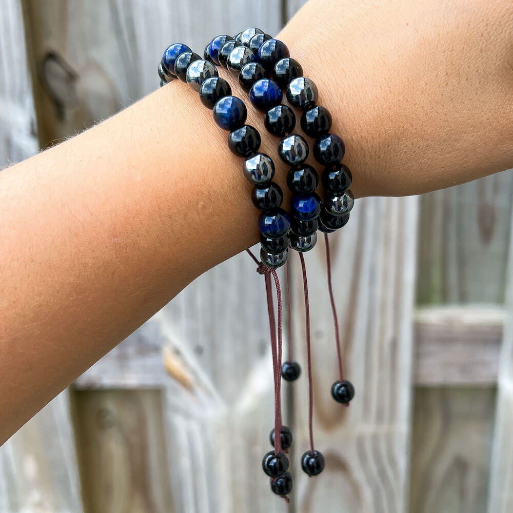 Looking for an adjustable bracelet? Shop at Magic Crystals for Blue Tiger Eye, Hematite, and Black Obsidian Adjustable Bracelet. Bracelet made of natural gemstones. Unisex jewelry adjustable bracelet. Color: Black and metallic, gray for Chakra: Third Eye, Solar Plexus, Sacral, Root. FREE SHIPPING