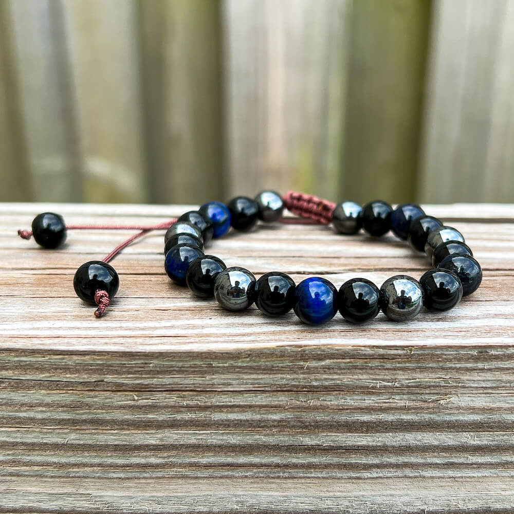 Looking for an adjustable bracelet? Shop at Magic Crystals for Blue Tiger Eye, Hematite, and Black Obsidian Adjustable Bracelet. Bracelet made of natural gemstones. Unisex jewelry adjustable bracelet. Color: Black and metallic, gray for Chakra: Third Eye, Solar Plexus, Sacral, Root. FREE SHIPPING