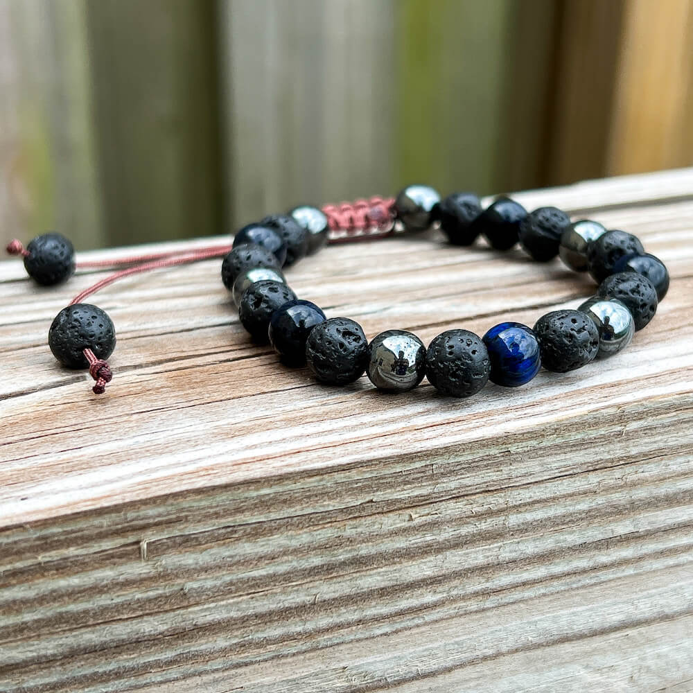 Looking for an adjustable bracelet? Shop at Magic Crystals for Blue Tiger Eye, Hematite, and Lava Stone Adjustable Bracelet. Bracelet made of natural gemstones and Lava stones for Oils Diffuser. Unisex jewelry adjustable bracelet. Color: Black, gray for Chakra: Third Eye, Solar Plexus, Sacral, Root. FREE SHIPPING