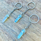 Opalite KEYCHAIN. Shop at Magic Crystals for Crystal Keychain, Pet Collar Charm, Bag Accessory, natural stone, crystal on the go, keychain charm, gift for her and him. Opalite is a great SPIRITUALITY. FREE SHIPPING available. Opalite Crystal Key Chain, Crystal Keyring, Opalite Crystal Key Holder. Opal, opalita stone.