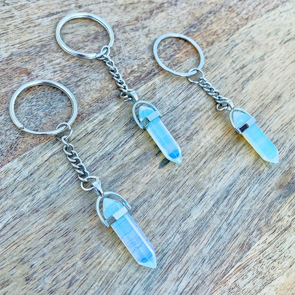 Opalite KEYCHAIN. Shop at Magic Crystals for Crystal Keychain, Pet Collar Charm, Bag Accessory, natural stone, crystal on the go, keychain charm, gift for her and him. Opalite is a great SPIRITUALITY. FREE SHIPPING available. Opalite Crystal Key Chain, Crystal Keyring, Opalite Crystal Key Holder. Opal, opalita stone.