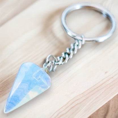 Opalite-Point-Keychain. Opalite KEYCHAIN. Shop at Magic Crystals for Crystal Keychain, Pet Collar Charm, Bag Accessory, natural stone, crystal on the go, keychain charm, gift for her and him. Opalite is a great SPIRITUALITY. FREE SHIPPING available. Opalite Crystal Key Chain, Crystal Keyring, Opalite Crystal Key Holder. Purple stone keys