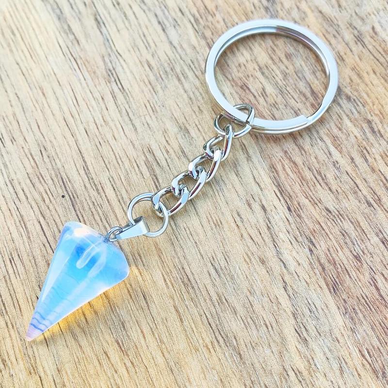Opalite-Point-Keychain. Opalite KEYCHAIN. Shop at Magic Crystals for Crystal Keychain, Pet Collar Charm, Bag Accessory, natural stone, crystal on the go, keychain charm, gift for her and him. Opalite is a great SPIRITUALITY. FREE SHIPPING available. Opalite Crystal Key Chain, Crystal Keyring, Opalite Crystal Key Holder. Purple stone keys