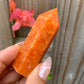 Looking for Natural orange calcite? Shop at Magic Crystals for a wand tower point obelisk semiprecious gemstone crystal Reiki Healing Crystals, Sacral Chakra, Passion, Protection.  Powerful for connecting with source energy.  FREE SHIPPING available. Orange Stone Calcite Stone.