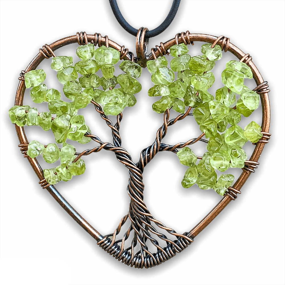 Peridot -Tree-of-Life-Copper-Wire-Heart-Necklace. Looking for Copper Jewelry? Magic Crystals offers handmade Heart Copper Wire Wrapped,  Tree Of Life,  Hematite Pendant Necklace, 7th Anniversary Gift, Yggdrasil Necklace for Him or Her Gift. Heart Gift perfect for any occasion. Heart Necklace With gemstones. Tree of Life made of copper in a pendant necklace.
