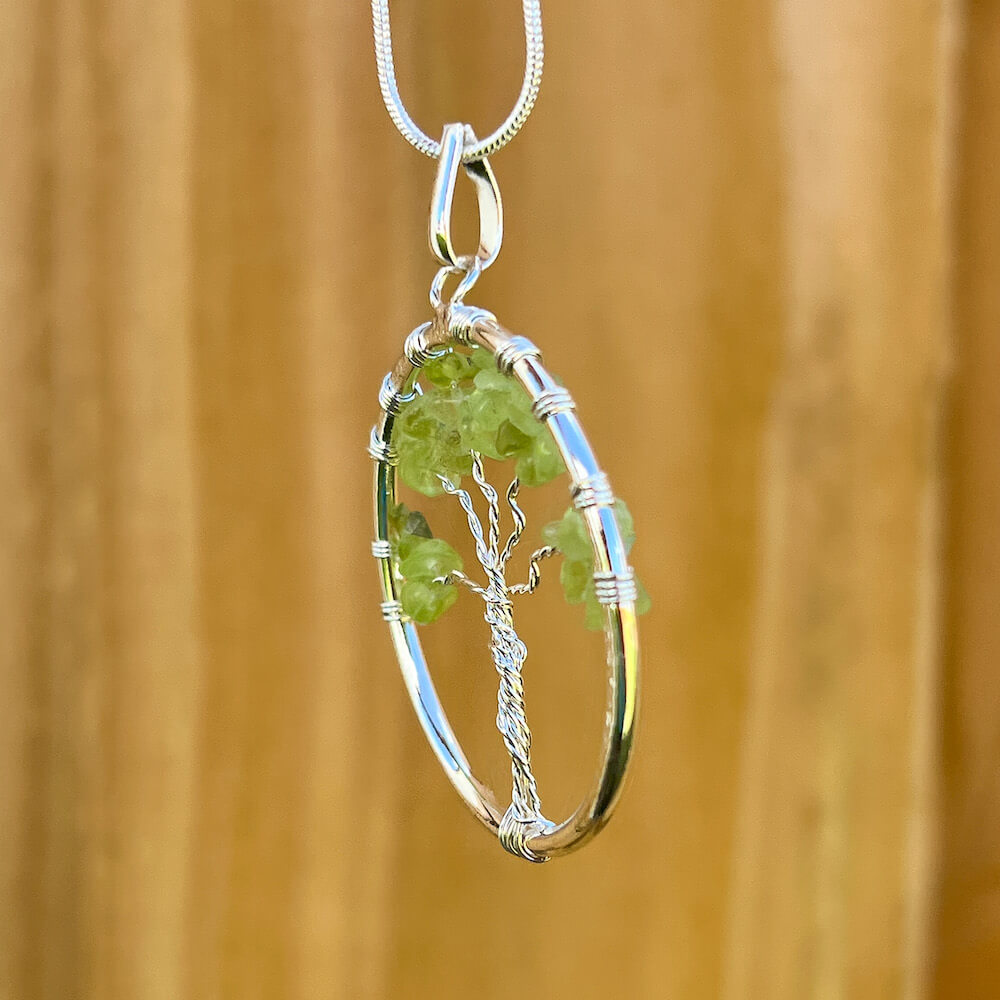 Looking for Peridot Jewelry? Shop at Magic Crystals for Peridot Stone Tree of Life Pendant Necklace. Using peridot gemstones is a wonderful way to encourage yourself to have a more positive attitude about the world. peridot healing bracelets, natural peridot necklace. Peridot pendant.