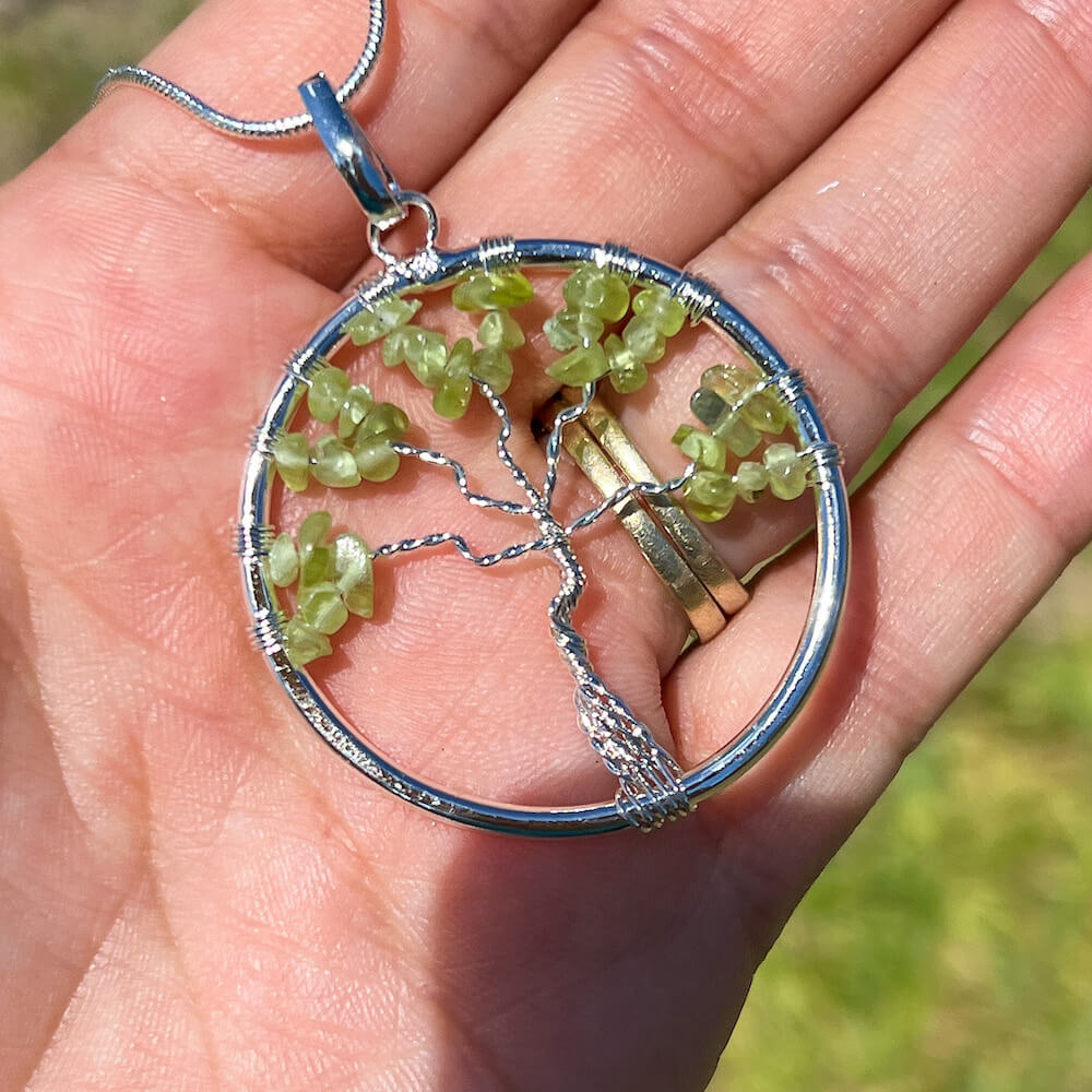 Looking for Peridot Jewelry? Shop at Magic Crystals for Peridot Stone Tree of Life Pendant Necklace. Using peridot gemstones is a wonderful way to encourage yourself to have a more positive attitude about the world. peridot healing bracelets, natural peridot necklace. Peridot pendant.