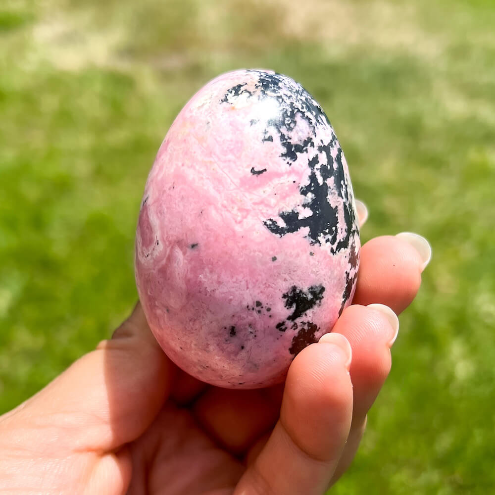 Shop for handmade Pink Rhodonite Egg -  Peruvian Rhodonite Carved Egg at Magic Crystals. Peruvian Pink Rhodonite Carved Egg - B. Rhodonite Polished Egg Healing Crystal Gemstone. Rhodonite is a wonderfully peaceful crystal. Enjoy FREE SHIPPING when you shop at magiccrystals.com. Undrilled crystal egg. Undrilled Pink Egg