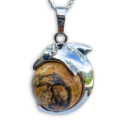    Picture-Jaspe--Sphere-Dolphin-Pendant-Necklace. Dolphin Necklace - Elegant Ocean-Themed Jewelry for Women Dolphin Charm Necklace at Magic Crystals. Boho Style Jewelry with Natural Gemstones. Stone Carved Dolphin Necklace Pendant, Beach Surf Ocean Boho Gemstone Whale Fairtrade Gift. These beautiful stone necklaces are all hand carved.