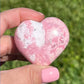 Shop for handmade Pink Rhodonite heart -  Peruvian Rhodonite Carved Heart at Magic Crystals. Rhodonite Polished Heart Healing Crystal Gemstone. Rhodonite is a wonderfully peaceful crystal. Enjoy FREE SHIPPING when you shop at magiccrystals.com