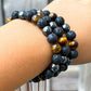 Looking for a protection bracelet? Shop at Magic Crystals for Yellow Tiger Eye, Hematite, and Lava Stone Bracelet. Bracelet made of natural gemstones and Lava stones for Oils Diffuser. Unisex jewelry adjustable bracelet. Color: Black and metallic, gray for Chakra: Third Eye, Solar Plexus, Sacral, Root. FREE SHIPPING