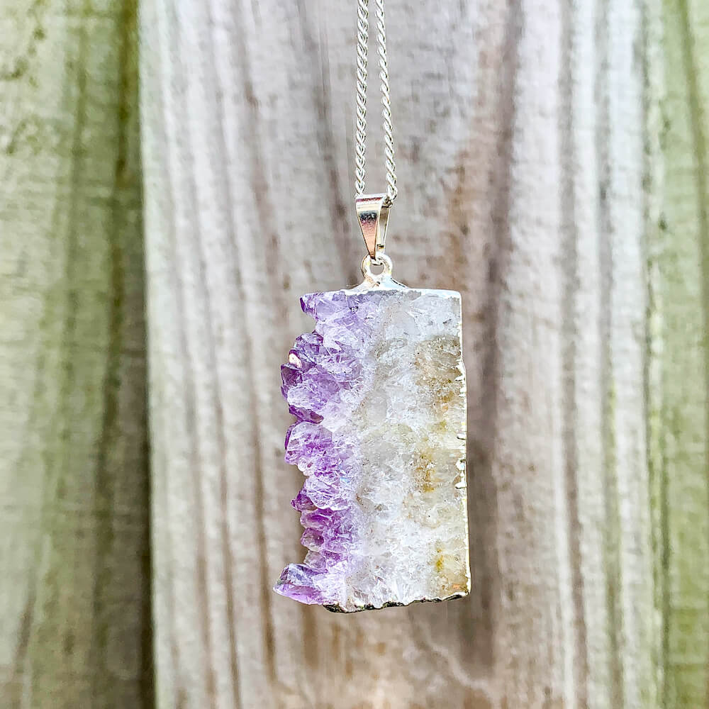Looking for Raw Amethyst Silver Plated Handmade Pendant Necklace? Shop at Magic Crystals for Amethyst Jewelry. Amethyst Stone necklaces are good for PROTECTION, PURIFICATION, and SPIRITUALITY. Raw Amethyst Slice Pendant February Birthstone Necklace Gold Filled Chain Rectangle. Purple Crystal Gift. Handmade Jewelry.