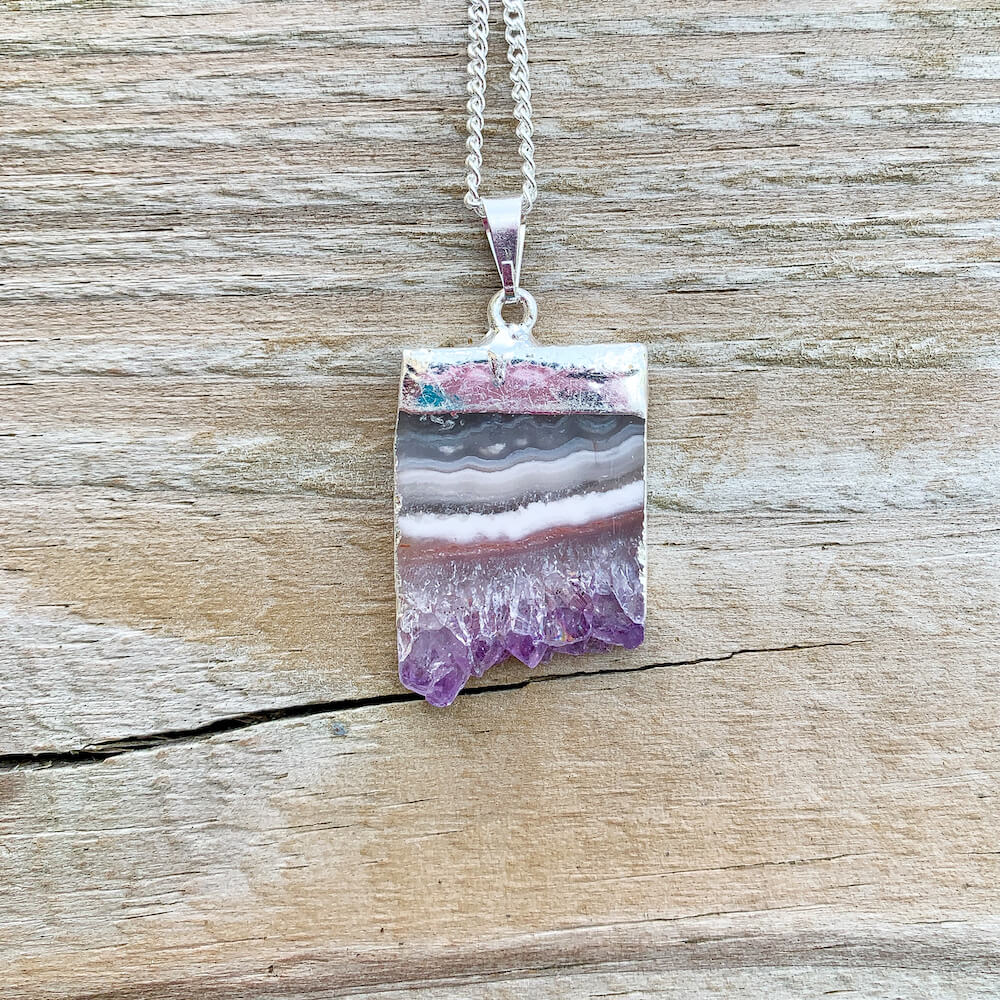 Looking for Raw sliced Amethyst Silver Plated Pendant Necklace? Shop at Magic Crystals for Amethyst Jewelry. Amethyst Stone necklaces are good for PROTECTION, PURIFICATION, and SPIRITUALITY. Raw Amethyst Slice Pendant February Birthstone Necklace Gold Filled Chain Rectangle. Purple Crystal Gift. Handmade Jewelry.