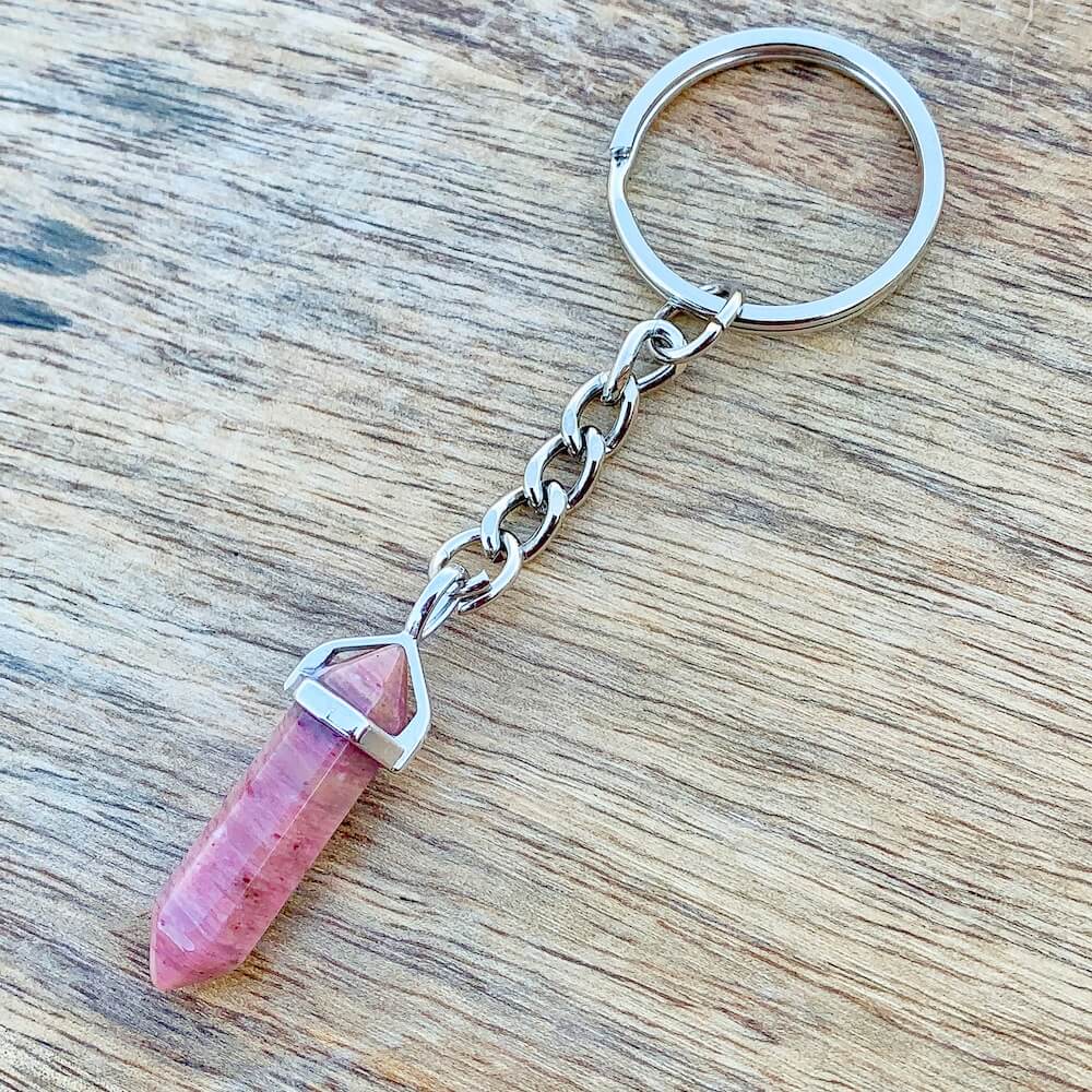 Rhodochrosite KEYCHAIN. Shop at Magic Crystals for Crystal Keychain, Pet Collar Charm, Bag Accessory, natural stone, crystal on the go, keychain charm, gift for her and him. Rhodochrosite is a great SPIRITUALITY. FREE SHIPPING available. Rhodochrosite Crystal Key Chain, Crystal Keyring, Rhodochrosite Crystal Key Holder