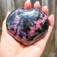 Looking for Rhodonite Heart Carving? Shop for handmade Rhodonite heart, Rhodonite Carved Heart - Rhodonite Stone at Magic Crystals. Rhodonite Polished Heart Healing Crystal Gemstone. Rhodonite is a wonderfully peaceful crystal. Enjoy FREE SHIPPING when you shop at magiccrystals.com