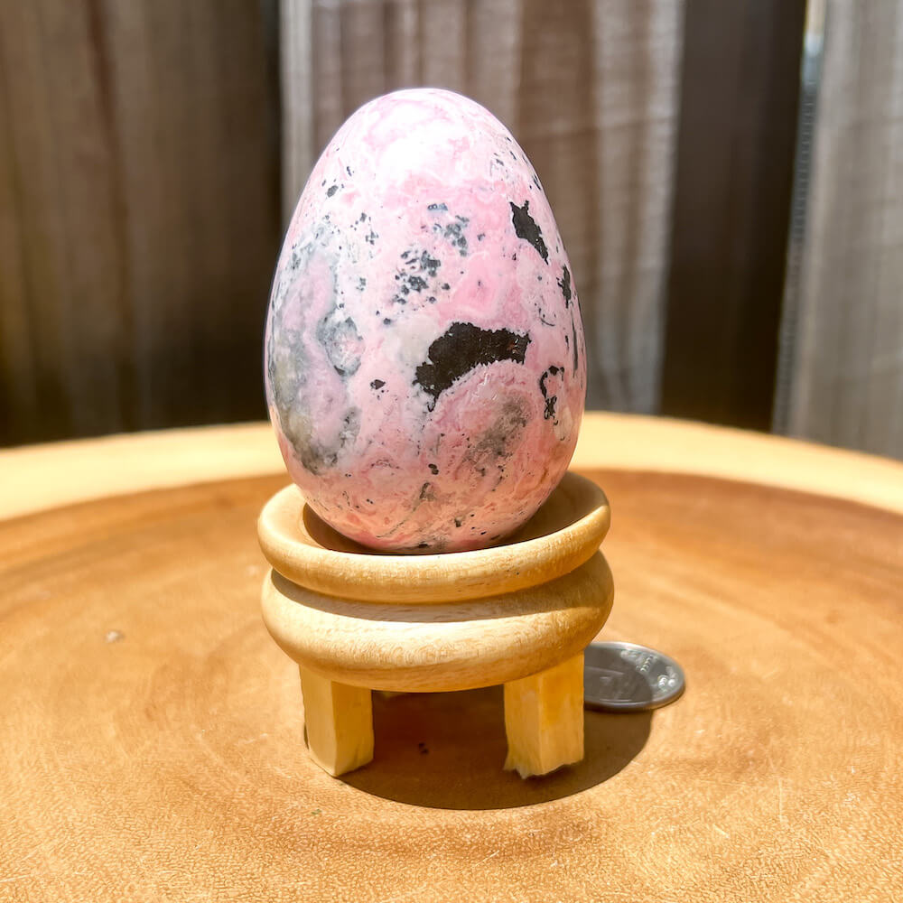 Shop for handmade Pink Rhodonite Egg -  Peruvian Rhodonite Carved Egg at Magic Crystals. Rhodonite Polished Egg Healing Crystal Gemstone. Rhodonite is a wonderfully peaceful crystal. Enjoy FREE SHIPPING when you shop at magiccrystals.com. Undrilled crystal egg. Undrilled Pink Egg.