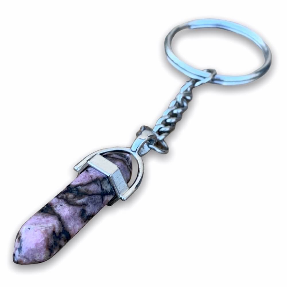Rhodonite Keychain. Rhodonite is a stone of compassion and love. It's an emotional balancer that clears away emotional wounds. Rhodonite Double Point Keychain - Crystal Keychain at Magic Crystals. Free shipping available. We carry a wide variety of keychains, gemstones, bracelets, earrings and handmade jewelry. 