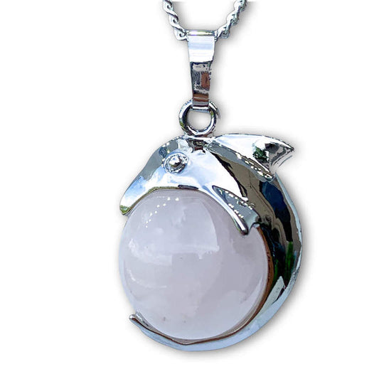    Rose-Quartz--Sphere-Dolphin-Pendant-Necklace. Dolphin Necklace - Elegant Ocean-Themed Jewelry for Women Dolphin Charm Necklace at Magic Crystals. Boho Style Jewelry with Natural Gemstones. Stone Carved Dolphin Necklace Pendant, Beach Surf Ocean Boho Gemstone Whale Fairtrade Gift. These beautiful stone necklaces are all hand carved.