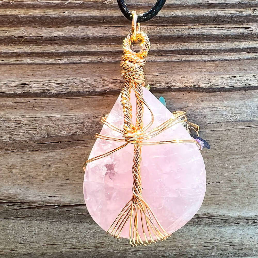    Rose-Quartz-Tree-Of-Life-Chakra-Necklace. Looking for a gift for mother/her, tree of life necklace, stone necklace, pendant? Shop at Magic Crystals for a 7 Chakra Tree Of Life Drop Necklace. 7 Chakra necklaces, and seven chakras jewelry pieces. Handmade Natural Amethyst Crystal. Amethyst Drop shape, teardrop, Protection Necklaces.