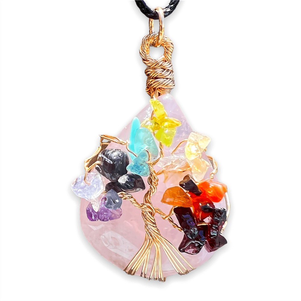    Rose-Quartz-Tree-Of-Life-Chakra-Necklace. Looking for a gift for mother/her, tree of life necklace, stone necklace, pendant? Shop at Magic Crystals for a 7 Chakra Tree Of Life Drop Necklace. 7 Chakra necklaces, and seven chakras jewelry pieces. Handmade Natural Amethyst Crystal. Amethyst Drop shape, teardrop, Protection Necklaces.