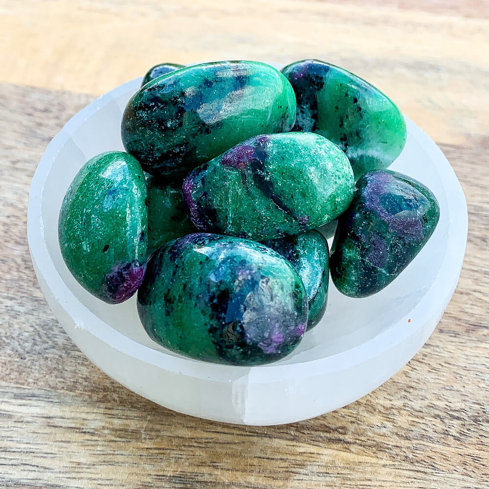 Looking for Ruby Fuchsite Crystal - ruby stone - ruby tumbled stone healing crystals and stones - heart chakra stone? Shop at MAGIC CRYSTALS. Ruby Fuchsite tumbled stone. Ruby initiates the pleasures of life and stimulates the heart, encouraging one to enjoy being in the physical world. FREE SHIPPING AVAILABLE.