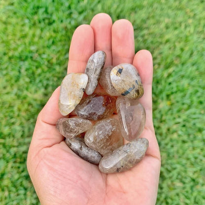 Buy Gold Rutilated Quartz Tumbled Stone - Gold Rutile crystals - Choose how many stones, Singles, or Bulk at Magic Crystals. FREE SHIPPING Crystal Gift, Gift, Gift for Friends, Gift for sister, Gift for Crystals Lovers at Magic Crystals. Golden rutile Quartz is known to aid in clarity, well-being, and willpower.