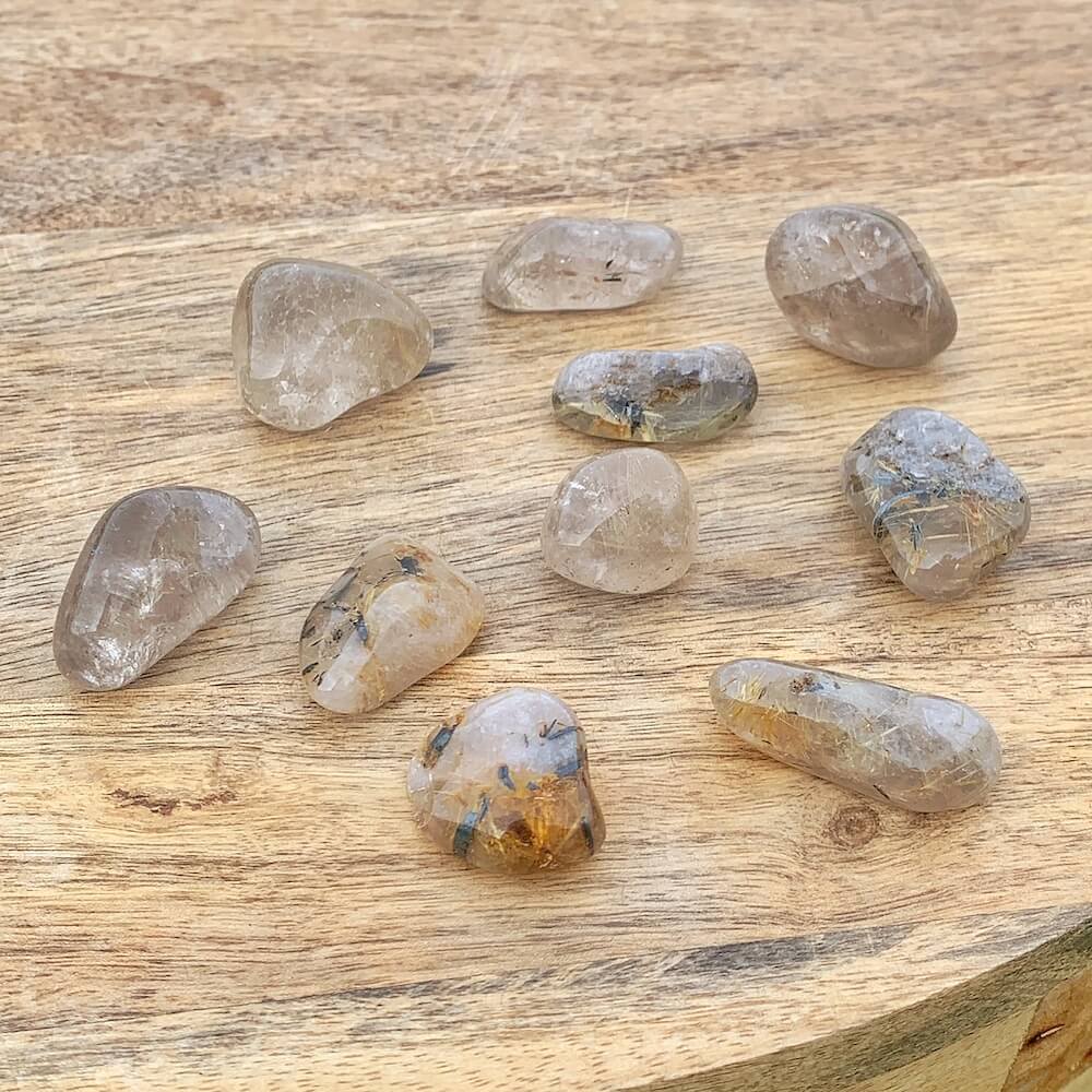 Buy Gold Rutilated Quartz Tumbled Stone - Gold Rutile crystals - Choose how many stones, Singles, or Bulk at Magic Crystals. FREE SHIPPING Crystal Gift, Gift, Gift for Friends, Gift for sister, Gift for Crystals Lovers at Magic Crystals. Golden rutile Quartz is known to aid in clarity, well-being, and willpower.