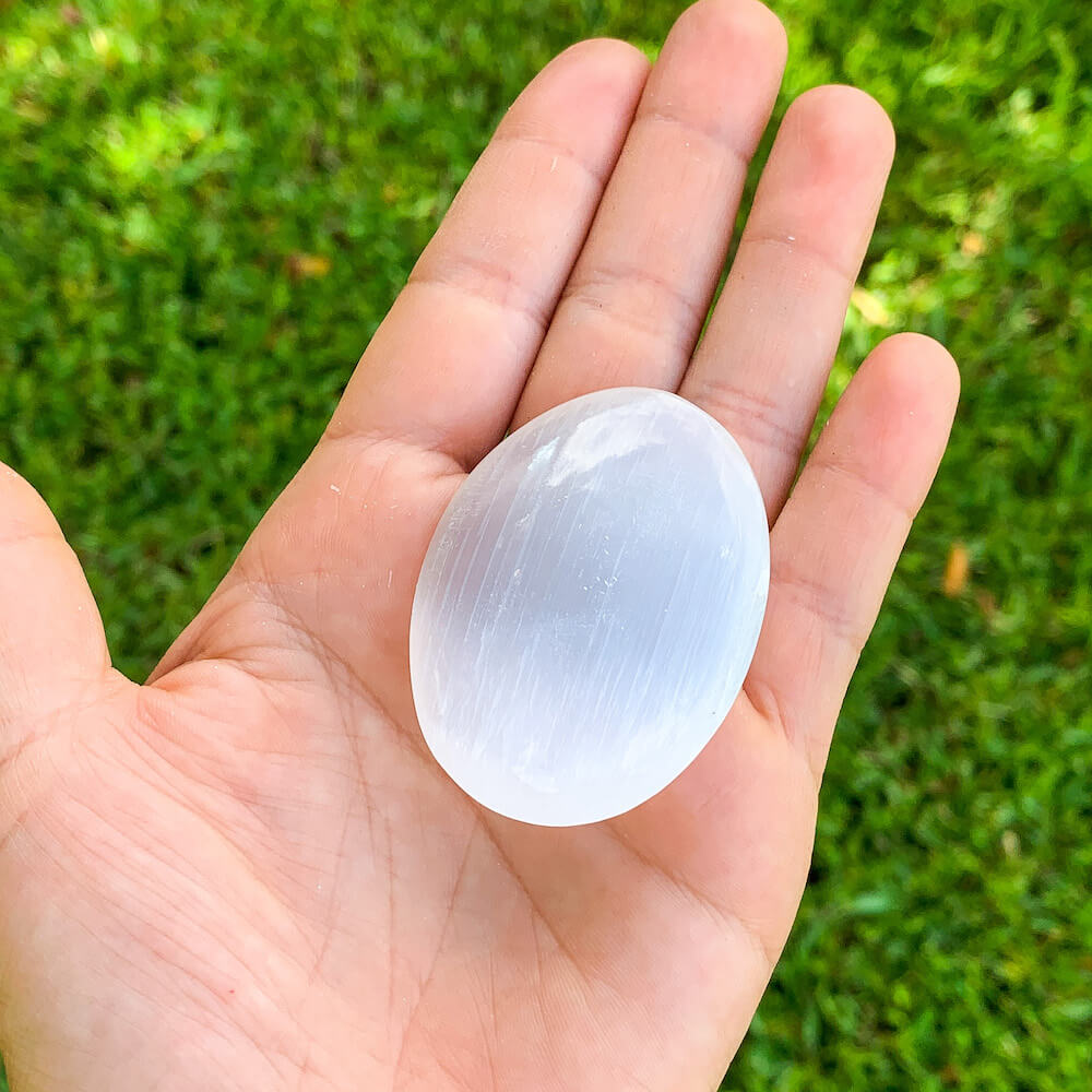 Looking for 2.5" Selenite Palm Stone, Selenite, Soap Shape Palm Stone, Cat Eye Reflection with Free Shipping? Shop at Magic Crystals for Selenite for Ritual plates, Polished Selenite Charging station. Crystal used for Protection Cleansing Meditation Crystal Healing Chakra, Selenite Alter,Selenite Flat Crystal Plate.