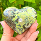 Serpentine-Puffy-Heart. Looking for Green Serpentine Heart? Shop at Magiccrystals.com for Genuine Green Peruvian Serpentine Magnatite Tower - Serpentine Tower - Stone Point - Jewelry Making Supplies and more. Magic Crystals FREE SHIPPING on quality crystals. Serpentine is associated with the heart chakra and increases love and nurturing.