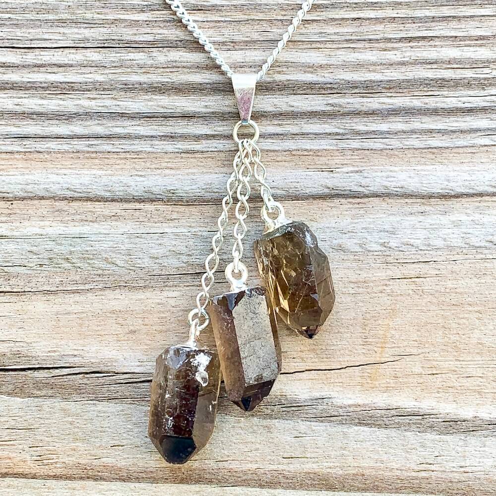 Looking for a Smokey quartz stone pendant necklace? Find a Triple Smoky Quartz Necklace when you shop at Magic Crystals. Natural Smoky Crystal Jewelry Healing Pendant Necklace. Smoky Quartz meaning is a stone that has been known to help with patience and peace.