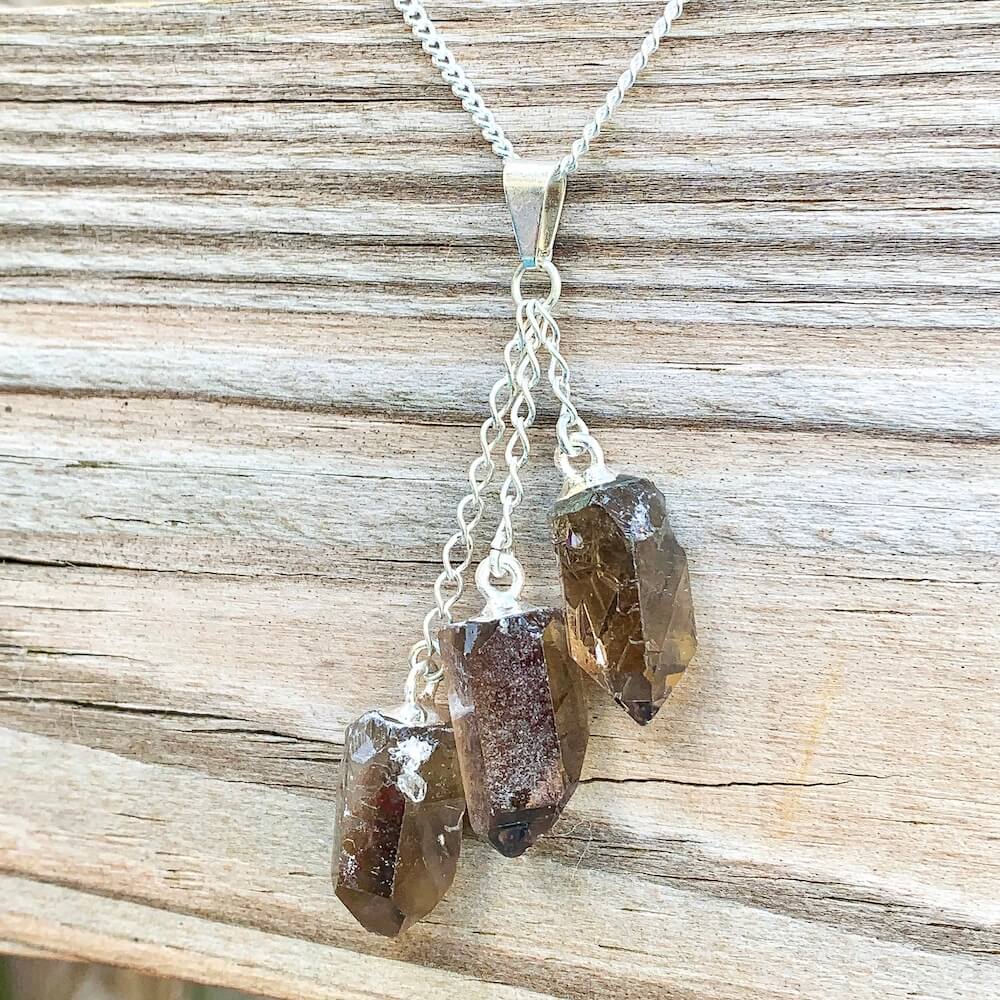 Looking for a Smokey quartz stone pendant necklace? Find a Triple Smoky Quartz Necklace when you shop at Magic Crystals. Natural Smoky Crystal Jewelry Healing Pendant Necklace. Smoky Quartz meaning is a stone that has been known to help with patience and peace.