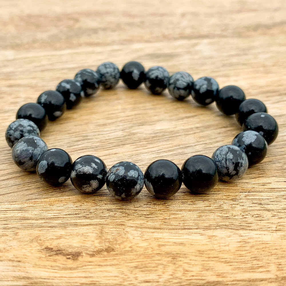 Looking for a Snowflake Obsidian bracelet? Shop at Magic Crystals for the best quality snowflake jewelry. We have 8 mm and 6mm  Round Bracelet Stretchy String bracelets for men and women. Healing Crystal Bracelet, Gemstone Bracelets, Bracelets for Women, Fathers Day and Mothers Day Gift, Reiki Jewelry.