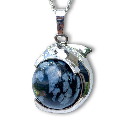   Snowflake-Obsidian-Sphere-Dolphin-Pendant-Necklace. Dolphin Necklace - Elegant Ocean-Themed Jewelry for Women Dolphin Charm Necklace at Magic Crystals. Boho Style Jewelry with Natural Gemstones. Stone Carved Dolphin Necklace Pendant, Beach Surf Ocean Boho Gemstone Whale Fairtrade Gift. These beautiful stone necklaces are all hand carved.