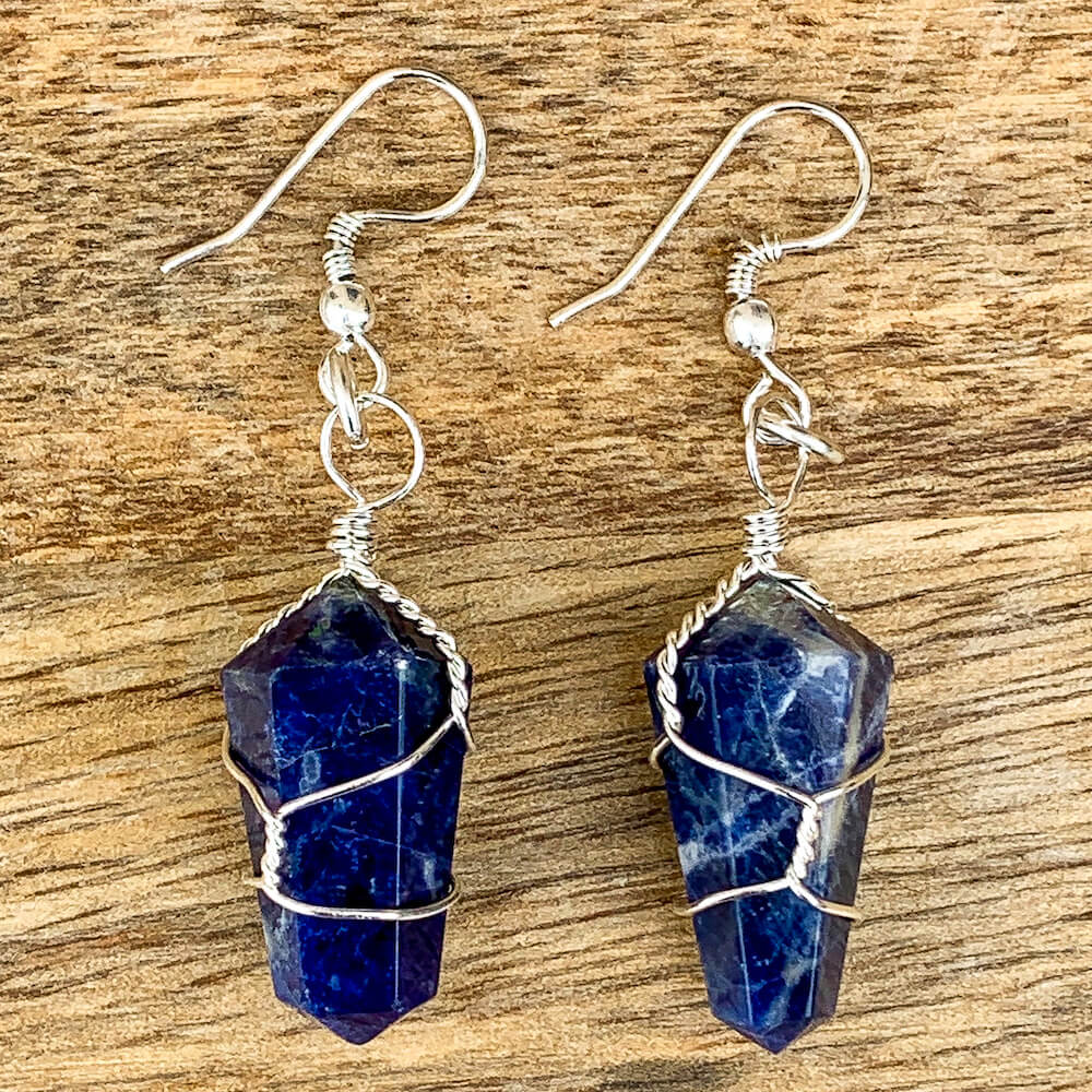  Looking for a Unique Blue Sodalite Earrings? Find Natural Sodalite Earrings, Sodalite Jewelry when you shop at Magic Crystals. Natural Blue Sodalite Crystal Healing Earrings. Called the Stone of Courage and the Stone of Truth. Blue Sodalite Earrings wire wrapped in Silver - Sodalite crystal point Earrings