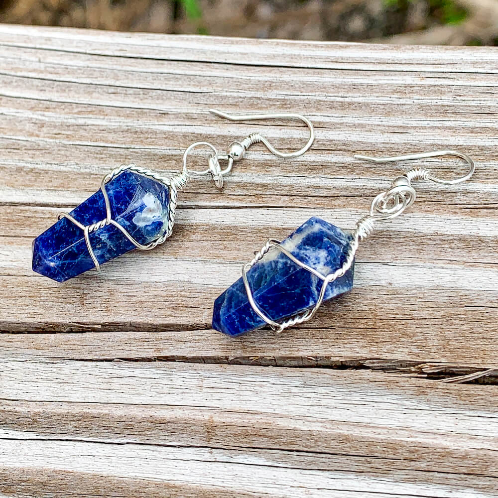 Looking for a Unique Blue Sodalite Earrings? Find Natural Sodalite Earrings, Sodalite Jewelry when you shop at Magic Crystals. Natural Blue Sodalite Crystal Healing Earrings. Called the Stone of Courage and the Stone of Truth. Blue Sodalite Earrings wire wrapped in Silver - Sodalite crystal point Earrings
