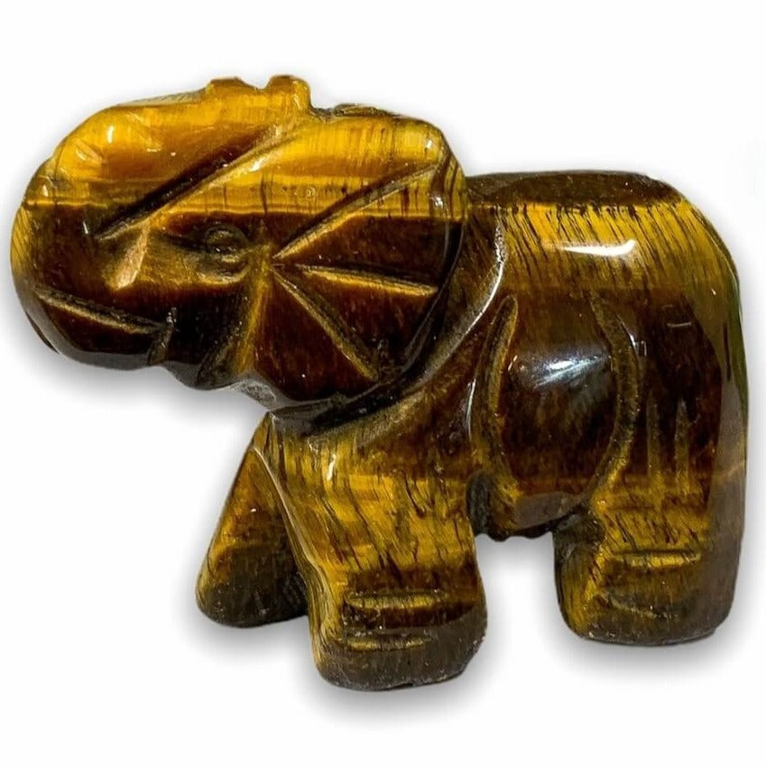 Looking for carved animals? Shop for our unique genuine Tiger Eye, Handmade Natural Crystal Carved, Tiger Eye elephant, crystal elephant, carved elephant, Quartz Crystal Elephant, Carving for Reiki healing. Tiger Eye Crystal ELEPHANT Shaped-Stone at Magic Crystals, with FREE SHIPPING available. Tiger Eye stones.