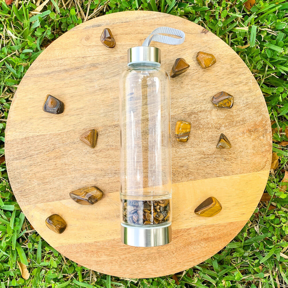    Tiger-Eye-Gemstone. Looking for Authentic Tumbled Crystal Water Bottle | Glass and Stainless Steel Water Bottle? Shop at Magic Crystals for Crystal Bottle, Stone Infused, Elixir, Stainless Steel and Environmentally Friendly bottle. 400 - 500 ml Tumbled Gemstone Unique Mineral Collection Gift. Gem Elixir Water Bottle.