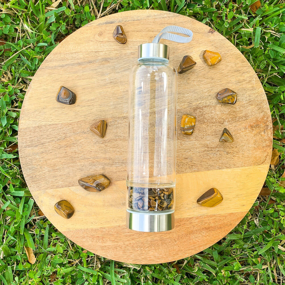    Tiger-Eye-Gemstone. Looking for Authentic Tumbled Crystal Water Bottle | Glass and Stainless Steel Water Bottle? Shop at Magic Crystals for Crystal Bottle, Stone Infused, Elixir, Stainless Steel and Environmentally Friendly bottle. 400 - 500 ml Tumbled Gemstone Unique Mineral Collection Gift. Gem Elixir Water Bottle.