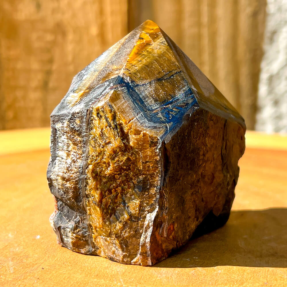 Tiger-Eye-Power-Point. Looking for a Polished Point - Stone Points - Crystal Points - Power Point - Crystal Point Large - Crystal Point Tower - Stone Point? MagicCrystals.com has a wide variety of crystal points to power you grid!. These are used as an Alter Crystal Tower.  Magic Crystals offers free shipping! Crystal Grid Point