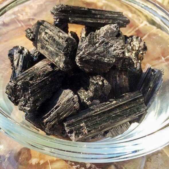 Shop for Black Tourmaline Crystal Chunks -  Rough Tourmaline at Magic Crystals . Black Tourmaline is a perfect mineral to protect your aura. FREE SHIPPING available. Tourmaline Raw stones. Genuine black tourmaline discs, pointers, crystals and stones.