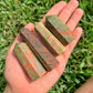 Looking for Unakite Stone Obelisk? Shop at Magic Crystals for Natural Unakite Towers, unalite carvings and more. These Unakite obelisks hold a power all their own as they symbolize the ancient obelisks found in Egypt. Shop Unakite obelisks, wands and pencil points. FREE SHIPPING available.