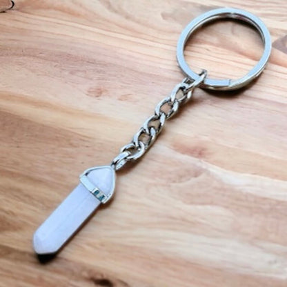 Cat's Eye keychain. Shop at Magic Crystals for Crystal Keychain, Pet Collar Charm, Bag Accessory, natural stone, crystal on the go, keychain charm, gift for her and him. Cat's Eye Natural Stone Keychain, Crystal Keychain, Cat's Eye Crystal Key Holder. pink, yellow, white, blue, and green gemstone.