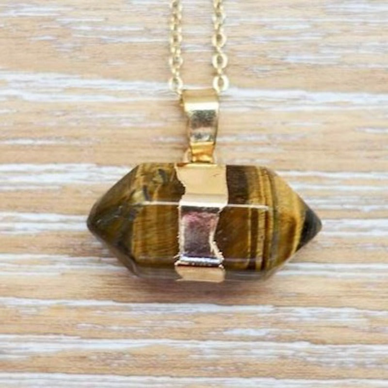 Looking for a tiger eye stone necklace? Find Tiger Eye Gold Stone Pendant Handmade Crystal Necklace at MagicCrystals.com .Natural mens tiger eye necklace. Yellow Tiger Eye Necklace Tiger eye pendant, gold tiger eye pendant, silver tiger eye pendant available when you shop at magic crystals. Tiger Eye crystal necklace.