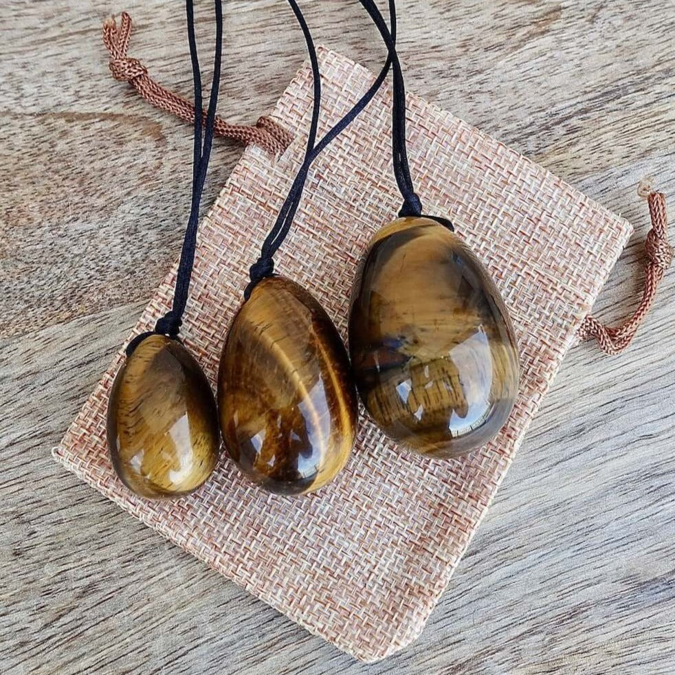 Yellow Tiger Eye Yoni Eggs Set. Free Shipping Available. Buy from Magic Crystals . Yoni Eggs 3-pcs Yoni Eggs Certified  jade eggs, Drilled, with String. Yoni Eggs are highly polished semi-precious gemstones carved especially for the female Yoni (vagina). Natural Yoni Eggs Set - Yoni Eggs drilled.